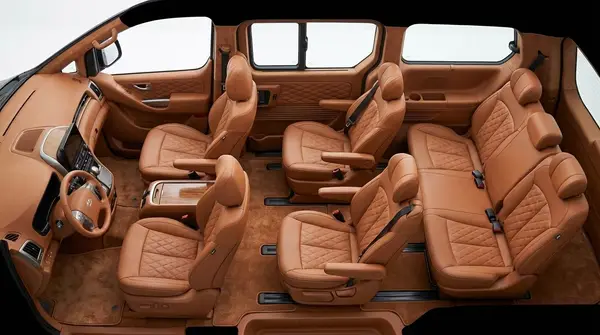 Tan leather captain seats inside a seven-seat van
