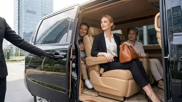 Driver opening the door of a premium private van
